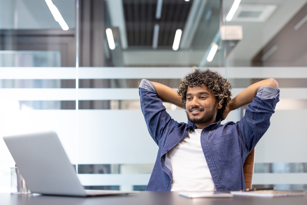 modern desktop search man happy at desk