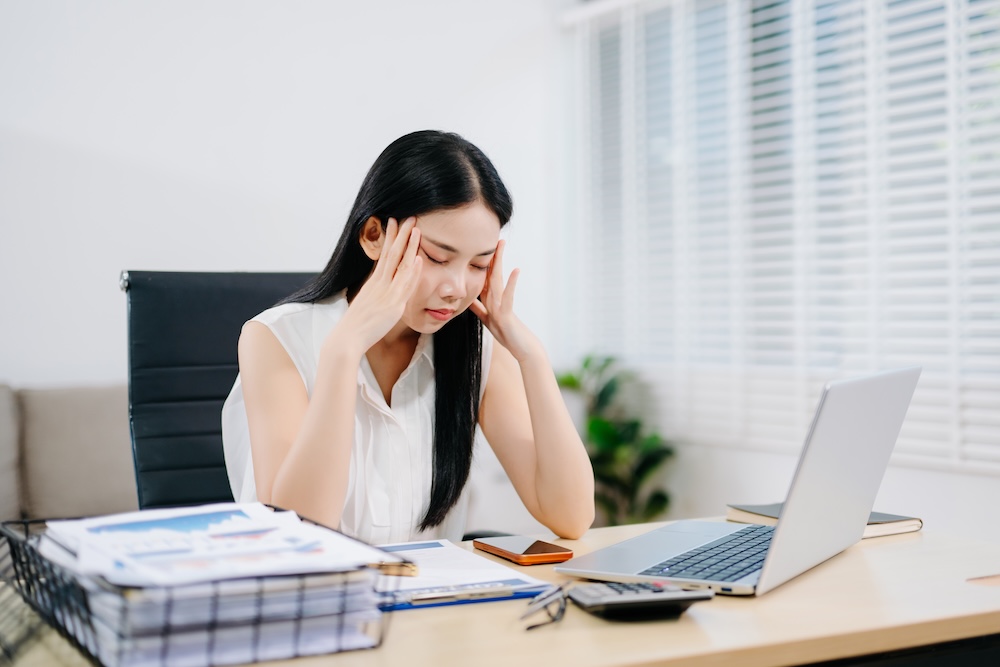 digital clutter stressed woman at computer